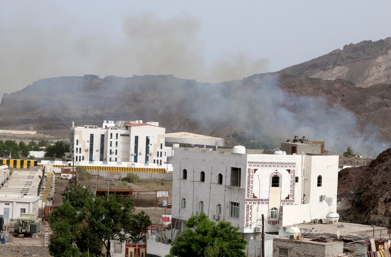 FILE PHOTO: Smoke rises during clashes in Aden