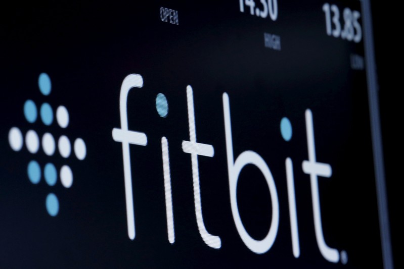 FILE PHOTO: The ticker symbol for Fitbit is displayed at the post where it is traded on the floor of the NYSE