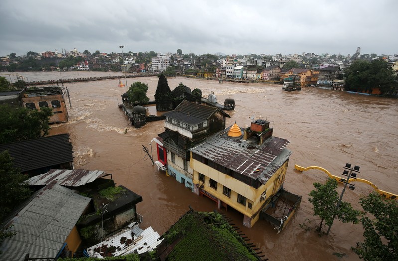 Houses are seen submerged in the waters of overflowing river Godavari after heavy rainfall in Nashik