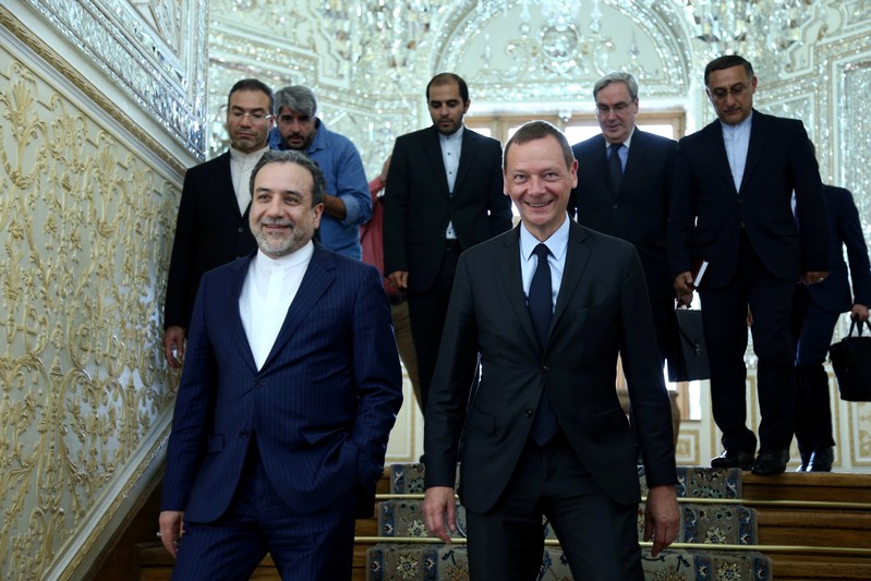 FILE PHOTO: Iran's deputy foreign minister, Abbas Araqchi, with visiting senior French diplomat Emmanuel Bonne in Tehran