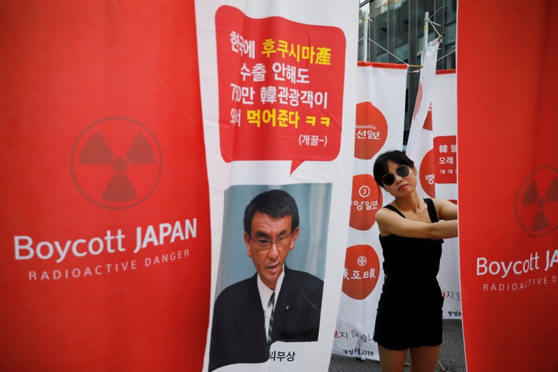FILE PHOTO: A South Korean woman attends an anti-Japan rally near the Japanese embassy in Seoul