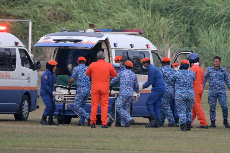 FILE PHOTO: A body believed to be 15-year-old Irish girl Nora Anne Quoirin who went missing is brought into a ambulance in Seremban