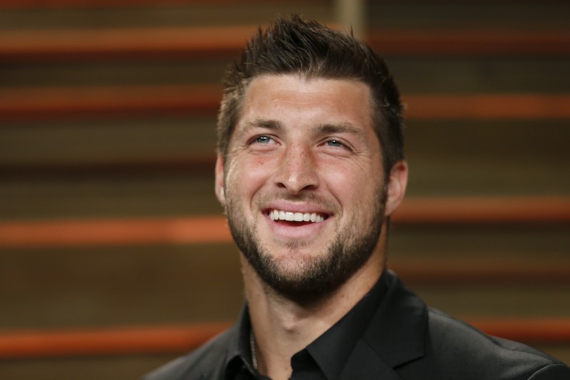FILE PHOTO: Former NFL player Tim Tebow arrives at the 2014 Vanity Fair Oscars Party in West Hollywood California