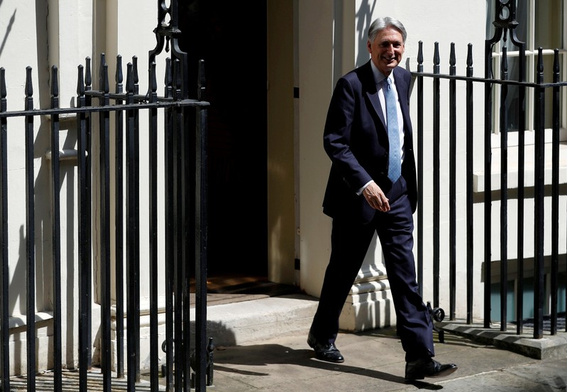 FILE PHOTO: Chancellor of the Exchequer Philip Hammond leaves Downing Street in London