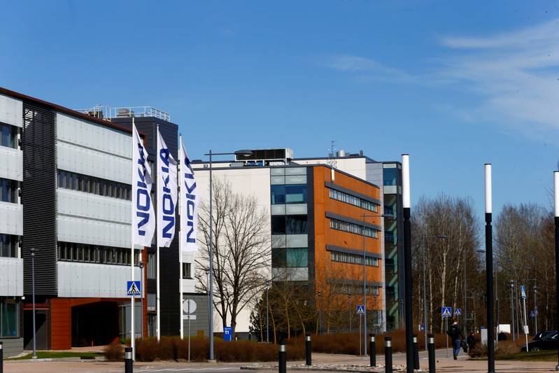 Flags with the Nokia logo flutter at company's headquarters in Espoo