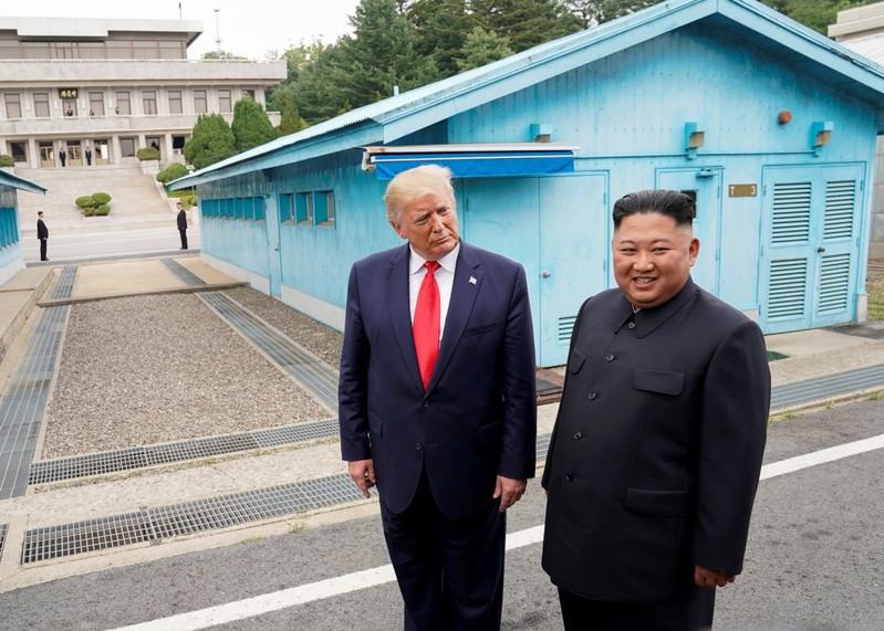 FILE PHOTO: Trump meets with North Korean leader Kim Jong Un at the DMZ on the border of North and South Korea