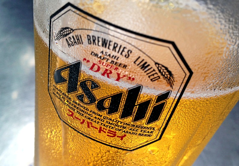 FILE PHOTO: Condensation collects on a glass of Asahi beer at a bar in Singapore