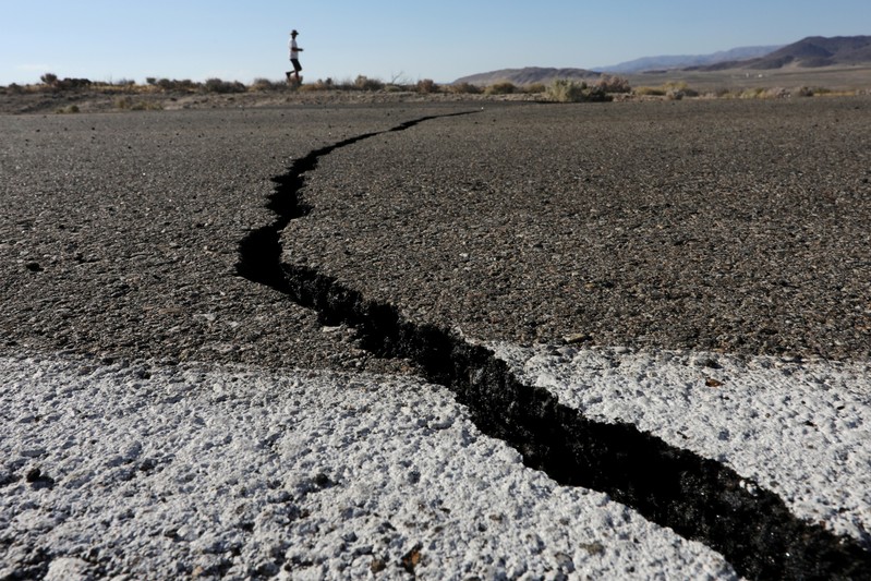 FILE PHOTO: Fissures that opened up under a highway during a powerful earthquake that struck Southern California are seen near the city of Ridgecrest