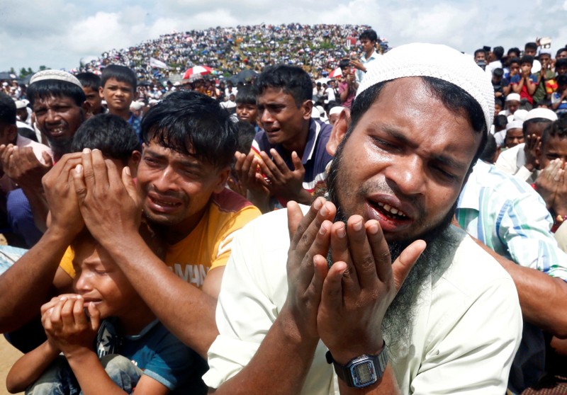 FILE PHOTO: Rohingya refugees take part in a prayer as they gather to mark the second anniversary of the exodus at the Kutupalong camp in Cox’s Bazar