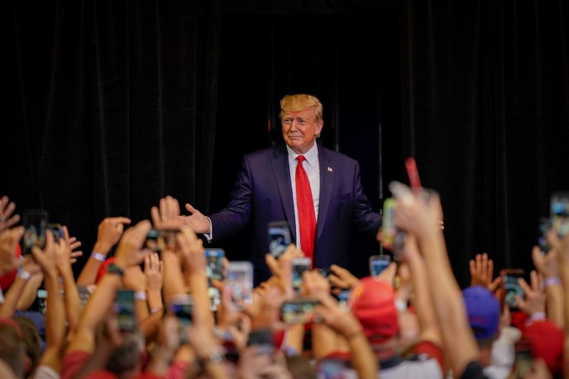 FILE PHOTO: U.S. President Donald Trump greets supports as he arrives at a campaign rally in Cincinnati