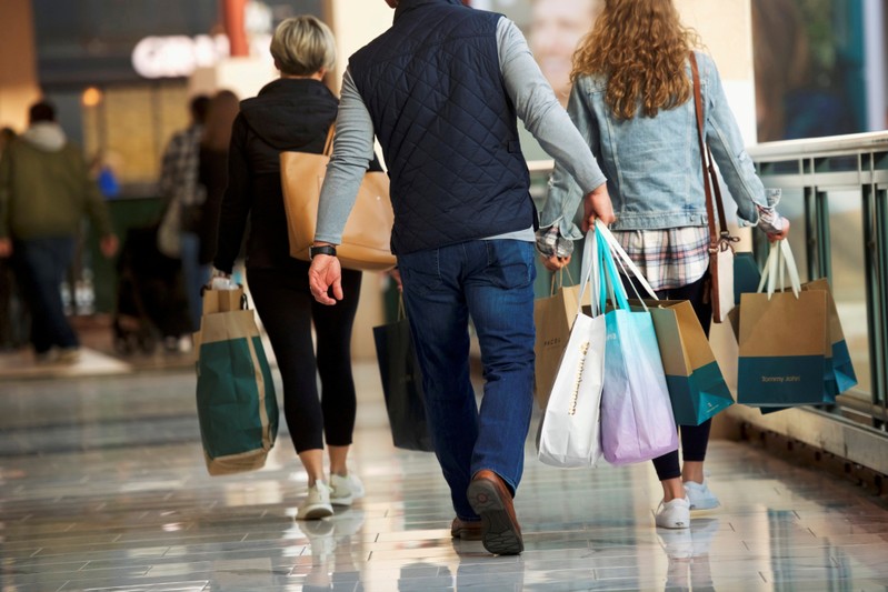 FILE PHOTO: Shoppers carry bags of purchased merchandise at the King of Prussia Mall in King of Prussia