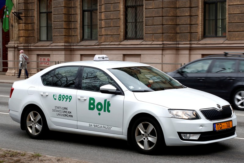 FILE PHOTO: A Bolt (formerly known as Taxify) sign is seen on the taxi car in Riga