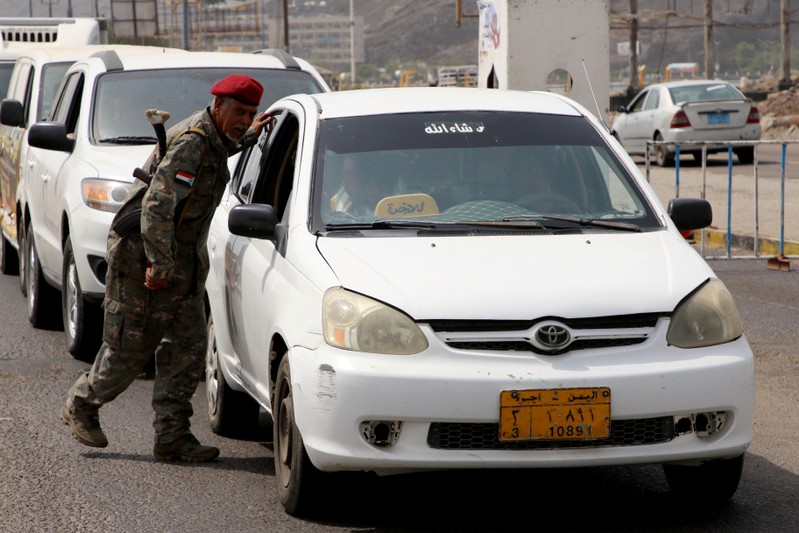 FILE PHOTO: Southern separatist fighter mans a checkpoint in Aden