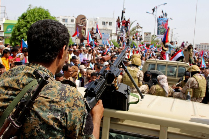 FILE PHOTO: Members of UAE-backed southern Yemeni separatists forces are seen together with their supporters as they march during a rally in southern port city in Aden