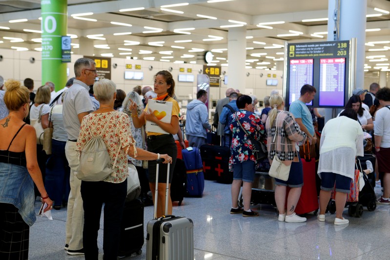 Thomas Cook passengers at the Mallorca airport on the second day of repatriations following the collapse of the giant tour operator