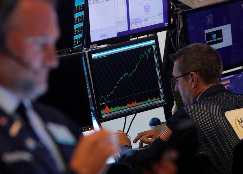 Traders work on the floor at the NYSE in New York