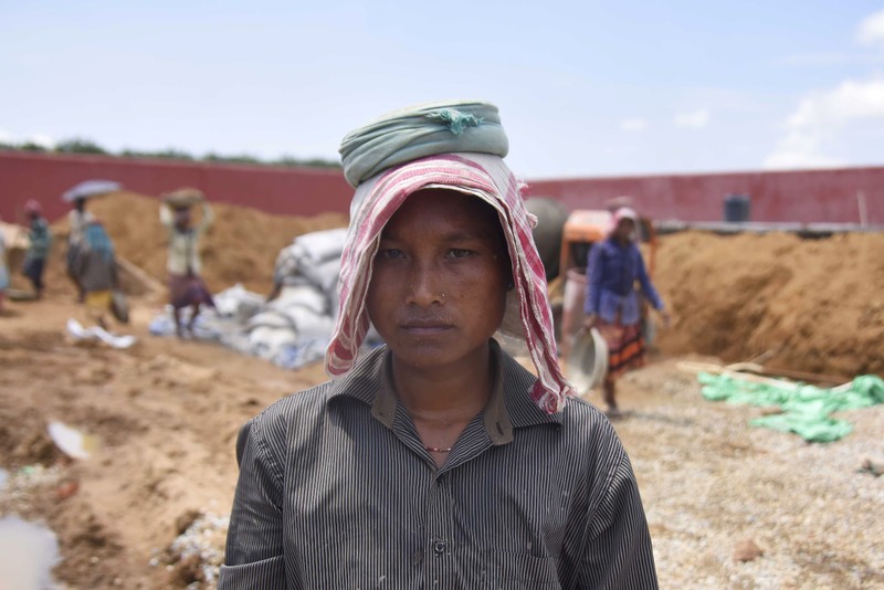 Shefali Hajong, a labourer whose name is excluded from the final list of the NRC, poses for a picture at the site of an under-construction detention centre for illegal immigrants at a village in Goalpara district
