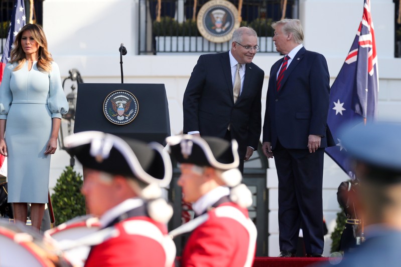 U.S. President Trump and Australia's Prime Minister Morrison chat during an arrival ceremony on the South Lawn of the White House in Washington