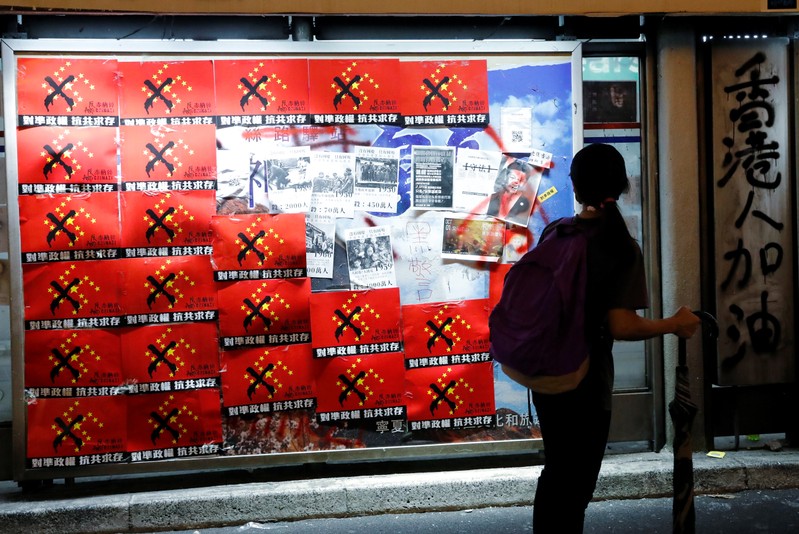 Anti-China posters are seen at a tram station in Hong Kong