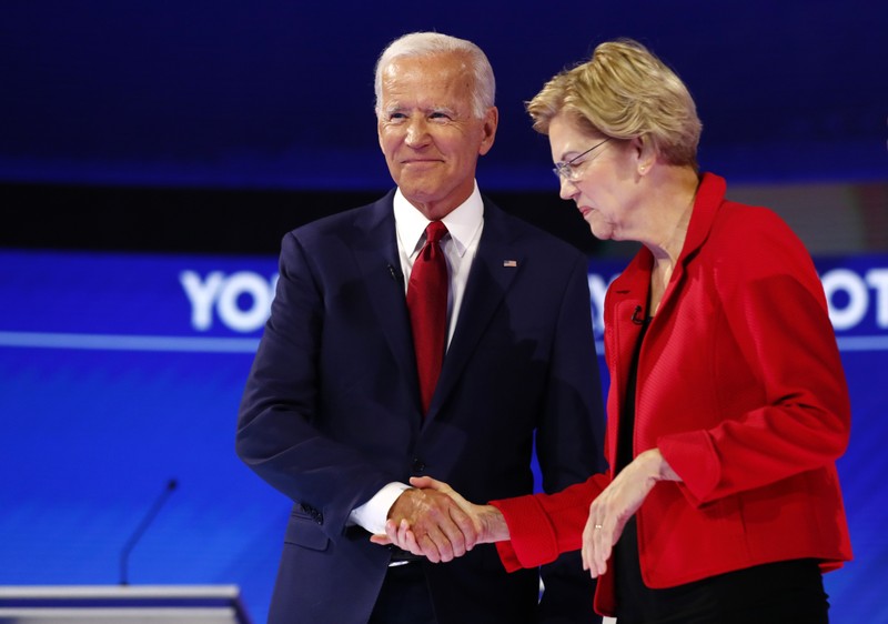 Former Vice President Biden shakes hands with Senator Warren at the start of the 2020 Democratic U.S. presidential debate in Houston, Texas, U.S.