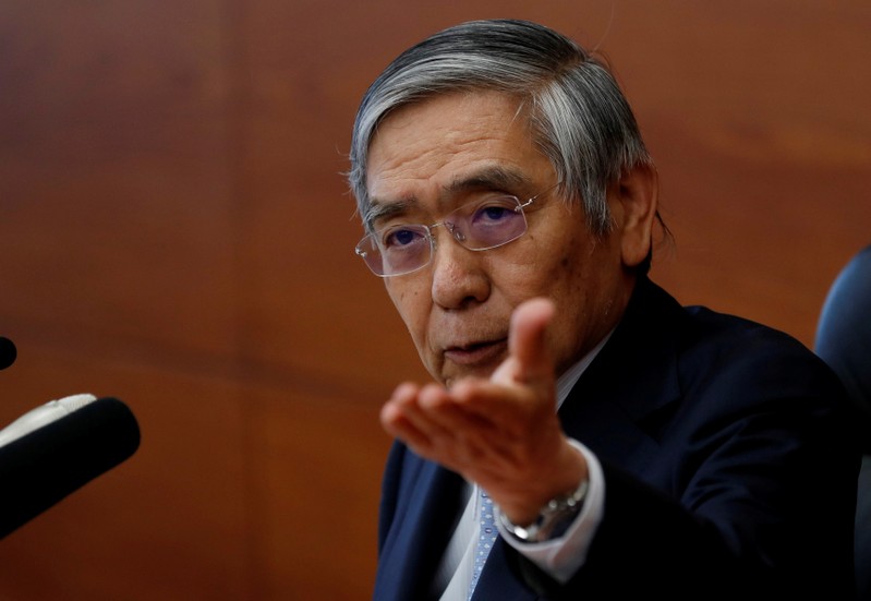 FILE PHOTO: Bank of Japan (BOJ) Governor Haruhiko Kuroda attends a news conference at the BOJ headquarters in Tokyo