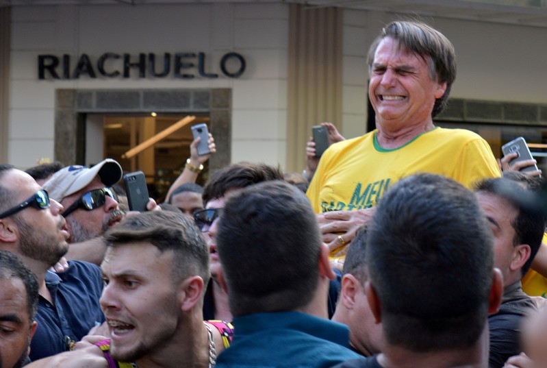 FILE PHOTO: Brazilian presidential candidate Jair Bolsonaro reacts after being stabbed during a rally
