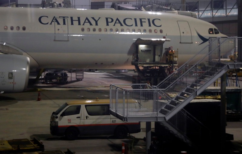 Workers service Cathay Pacific flight at Hong Kong International Airport