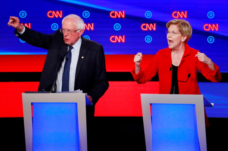 FILE PHOTO: U.S. Senators Sanders and Warren speak on the first night of the second 2020 Democratic U.S. presidential debate in Detroit, Michigan