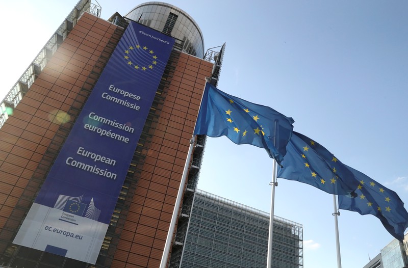 European Union flags flutter outside the European Commission headquarters, in Brussels