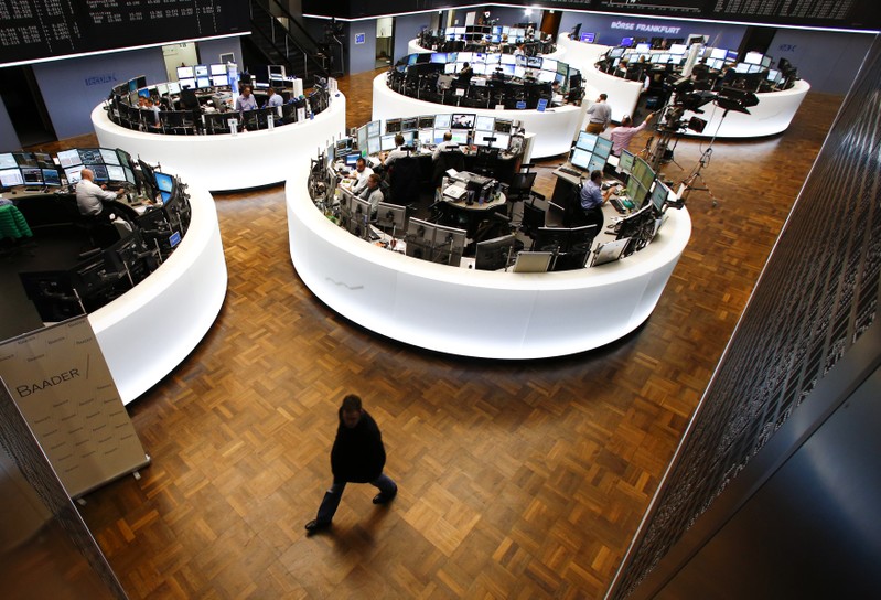 A trader walks across the trading floor at the Frankfurt stock exchange