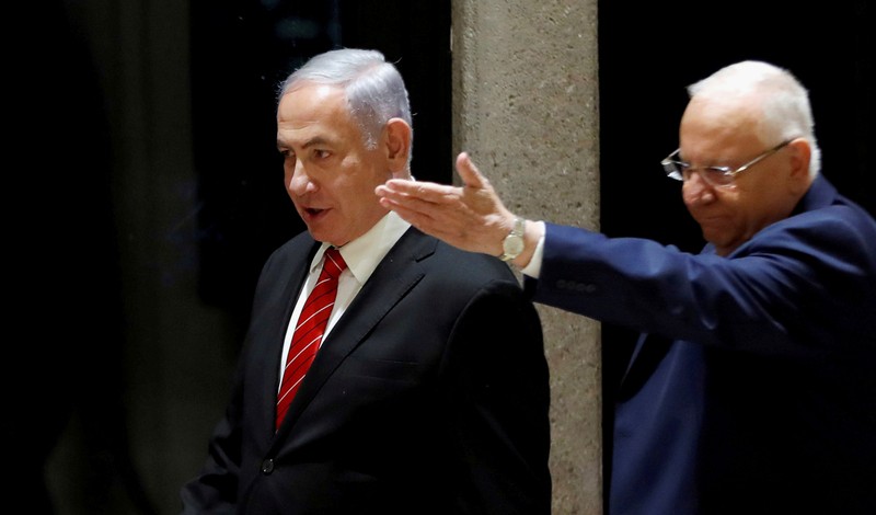 FILE PHOTO: Israeli President Reuven Rivlin and Prime Minister Benjamin Netanyahu arrive to a nomination ceremony at the President's residency in Jerusalem
