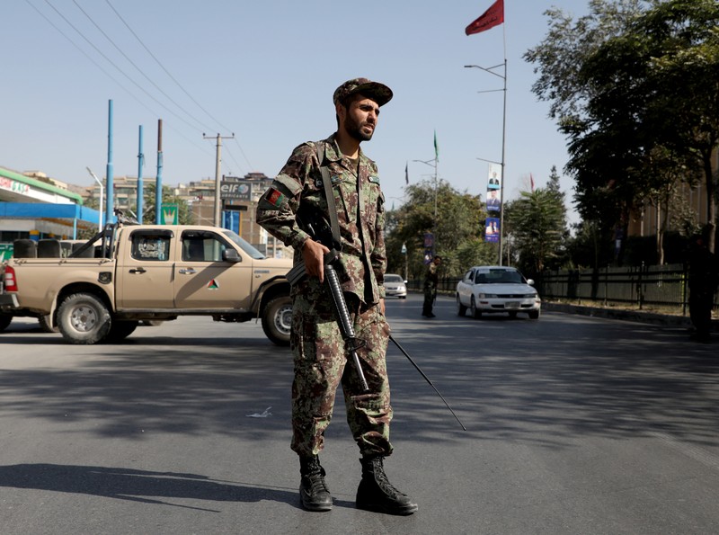 An Afghan National Army (ANA) soldier stands guard at a check point in Kabul, Afghanistan