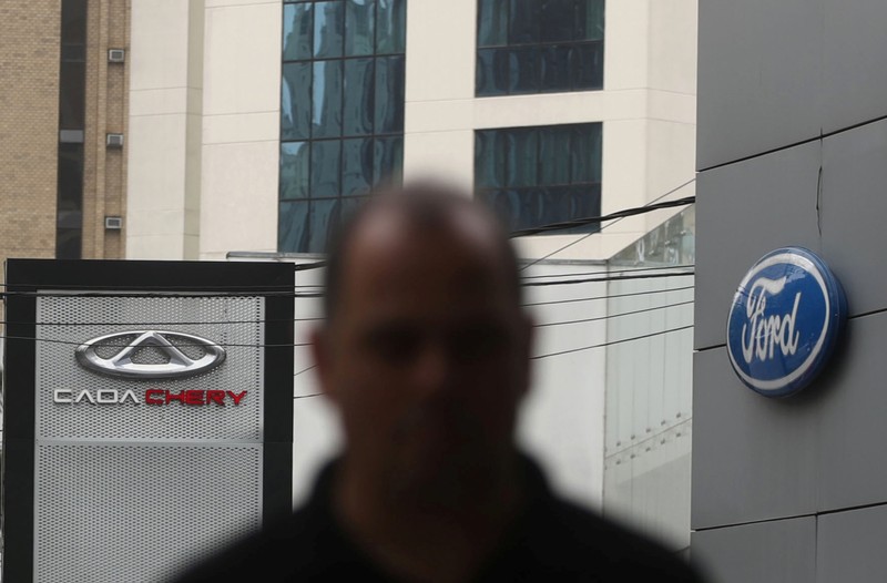 Logos of car manufacturers Caoa Chery and Ford are seen in front of dealerships of the companies in Sao Paulo