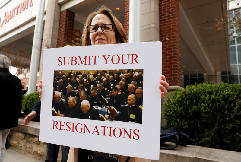 FILE PHOTO: Anne Barrett Doyle, co-director of BishopAccountability.org, holds a sign during the protest outside the venue of the United States Conference of Catholic Bishops (USCCB) general assembly in Baltimore