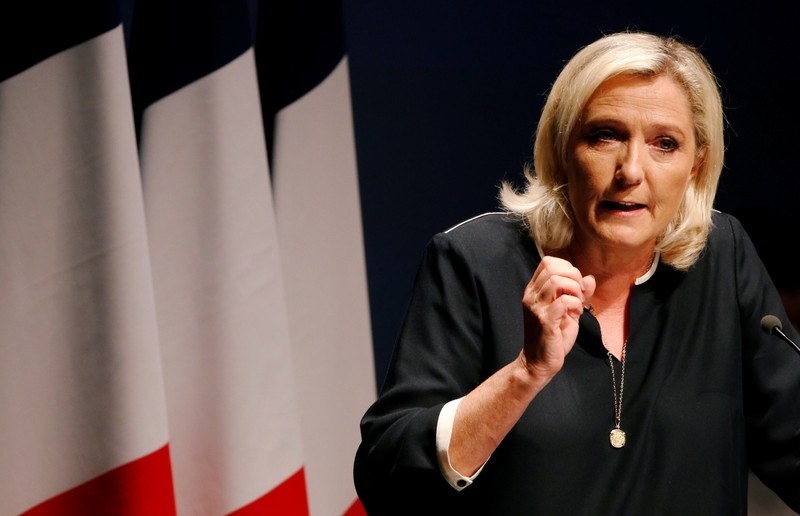 France's far-right leader Marine Le Pen delivers a speech for the next year's municipal elections in an end-summer annual address to partisans in Frejus