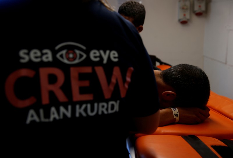 FILE PHOTO: An ill Tunisian migrant is treated in the clinic on the German NGO Sea-Eye migrant rescue ship 'Alan Kurdi' in international waters off Malta in the central Mediterranean Sea