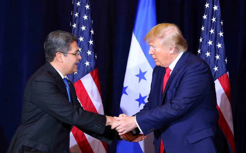 Honduras President Juan Orlando Hernandez shakes hands with U.S. President Donald Trump during the signing of an agreement where Honduras will accept more asylum seekers heading to the U.S. under latest U.S. immigration deal, in New York