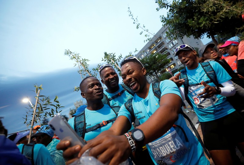 Activist and treegrower Sokomani takes a selfies as he prepares for the start of the Cape Town marathon