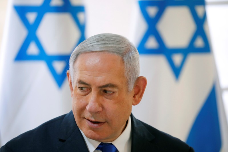 Israeli Prime Minister Benjamin Netanyahu gestures during a weekly cabinet meeting in the Jordan Valley, in the Israeli-occupied West Bank