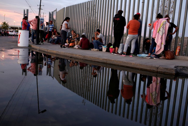 FILE PHOTO: Mexican citizens fleeing violence, camp in a queue to try to cross into the U.S. to apply for asylum at Cordova-Americas border crossing bridge in Ciudad Juarez