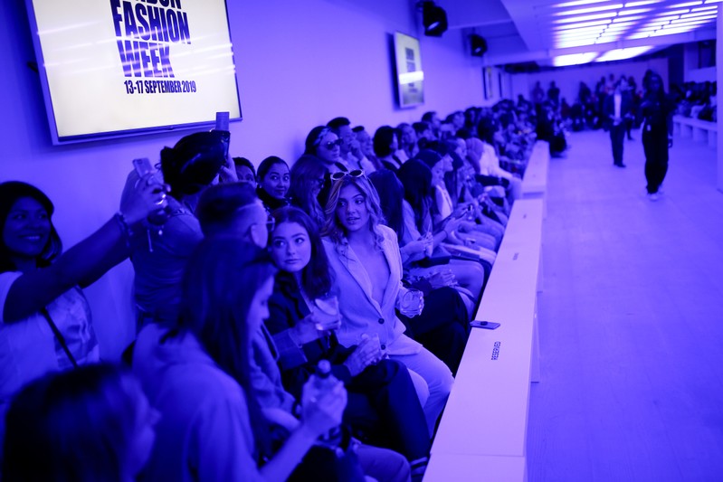 Members of the public attend the Alexa Chung public catwalk show during London Fashion Week in London