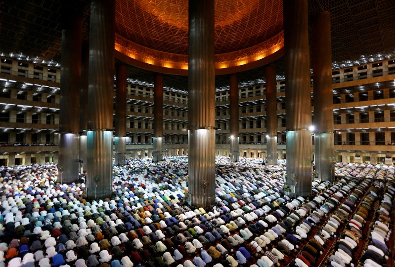 FILE PHOTO: Indonesian Muslims pray on the first day of the holy fasting month of Ramadan at Istiqlal mosque in Jakarta
