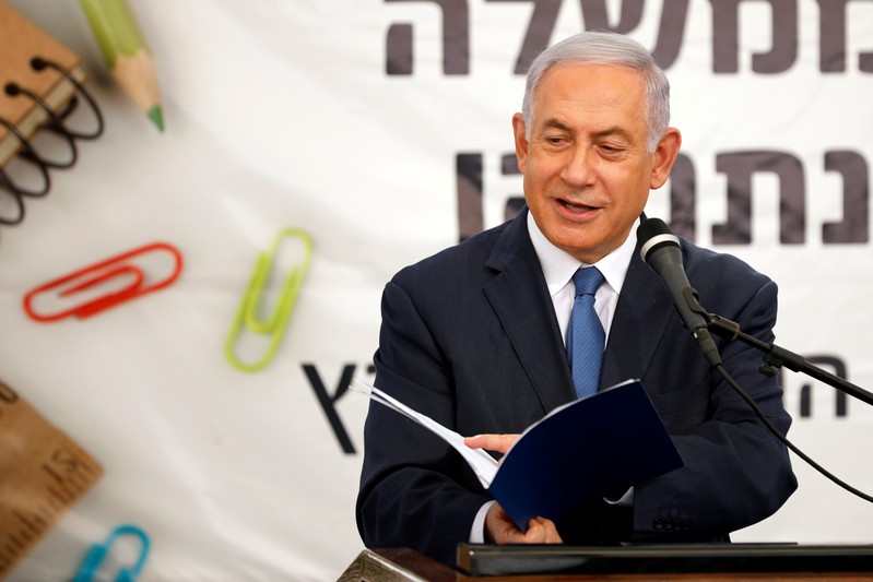 Israeli Prime Minister Benjamin Netanyahu speaks during a ceremony opening the school year in the Jewish settlement of Elkana in the Israeli-occupied West Bank