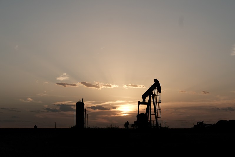 FILE PHOTO: Oil pump jacks work at sunset near Midland