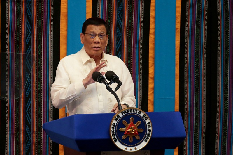 FILE PHOTO: Philippine President Rodrigo Duterte gestures during his fourth State of the Nation Address at the Philippine Congress in Quezon City