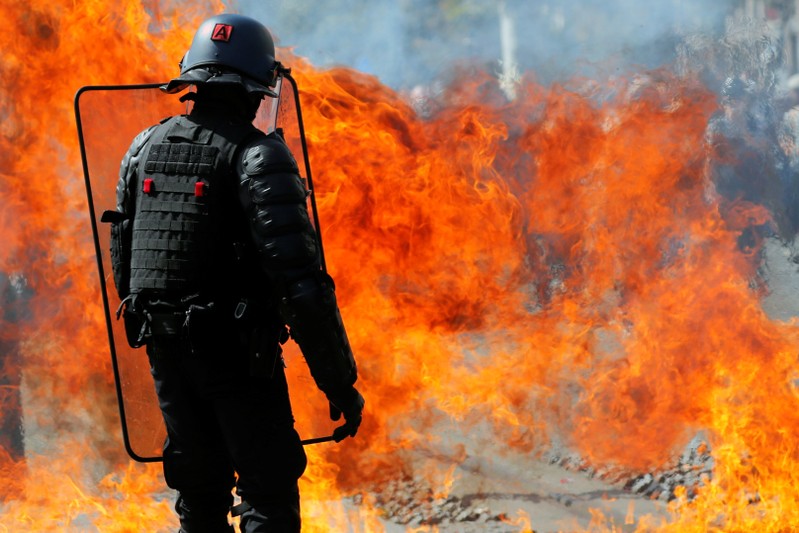 A molotov cocktail explodes in front of a French gendarme during a demonstration on Act 44 (the 44th consecutive national protest on Saturday) of the yellow vests movement in Nantes