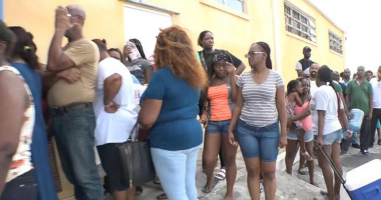 Residents wait in long lines for water on Grand Bahama island