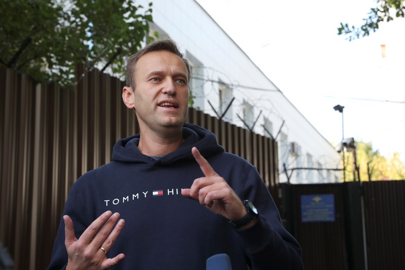 Russian opposition leader Navalny speaks with journalists outside a detention centre in Moscow