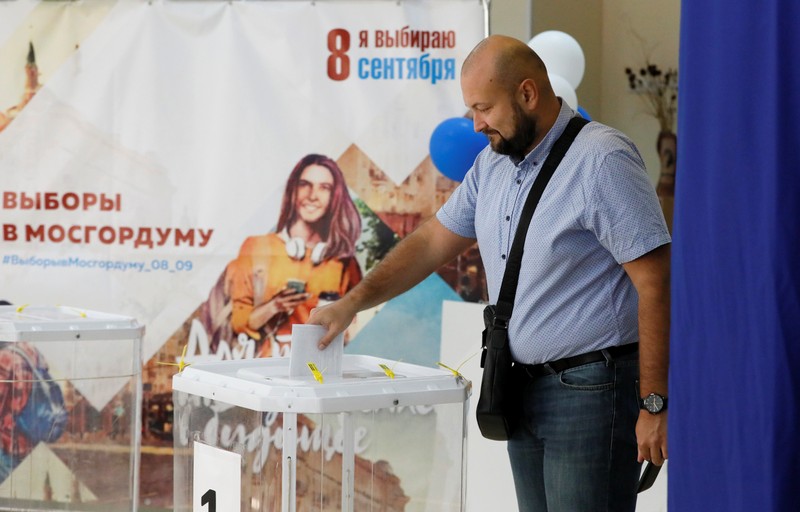 A man casts his ballot at a polling station during the Moscow city parliament election in Moscow