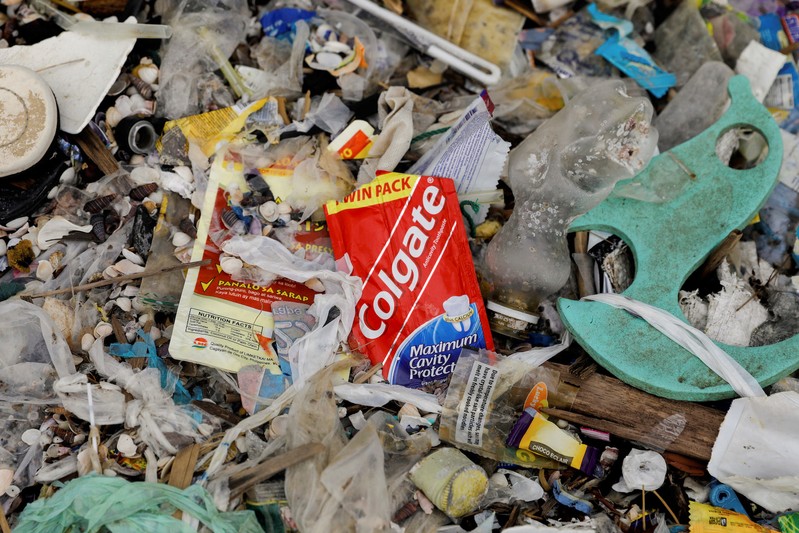 Sachet of Colgate toothpaste is pictured amidst a garbage-filled shore on Freedom Island, Paranaque City